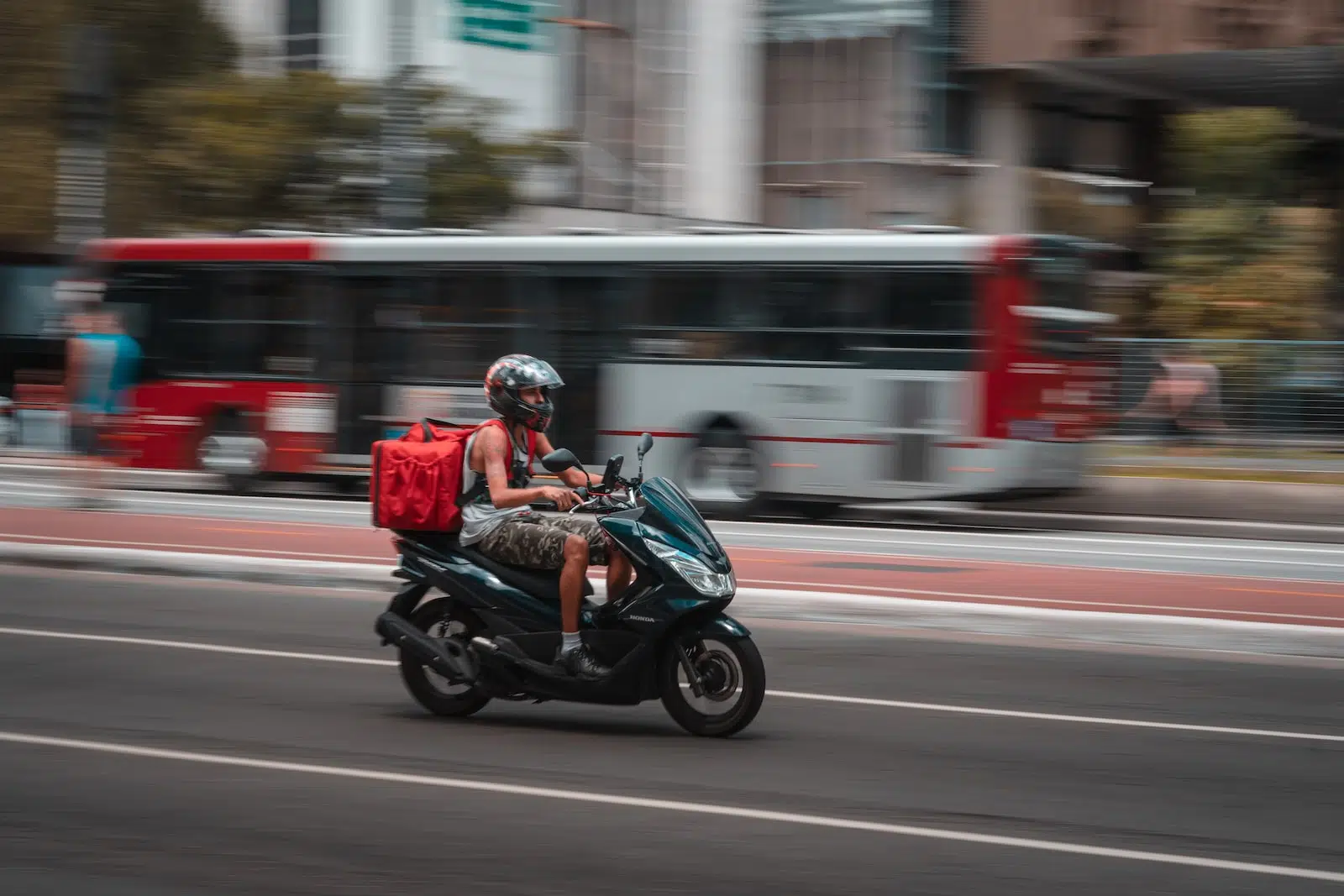 man in blue jacket riding motorcycle on road during daytime